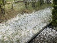 The side yard filled with hail