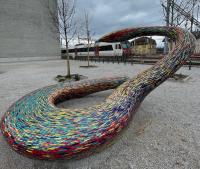 A tiled snake statue outside of the Platforme 10 in Lausanne