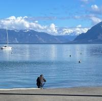 Marco hunkers on the shore of Lake Geneva