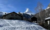 Large stone house with the Matterhorn