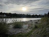 The greatly diminished Rhine river in Basel near sunset