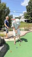 Dad lines up another deadly putt at Mr. Shake