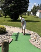 Dad putts for the easy win on the 18th hole