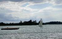 A sailboat zooming back into the bay at Auslikon