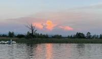 A tower of sunlit clouds over the Pfäffikersee