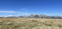 Looking at Säntis across the dry grasses at Gamserrugg