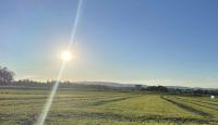 The late-afternoon sun over the fields outside Ettenhausen and Kempten
