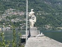 Two huge seagulls guard a statue on the Isola di Brissago