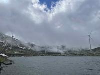 Windmills rear up out of the clouds on the Gotthard Pass