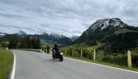 A motorcycle zooms down the Sattelegg