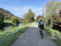 Adi rides along the Glatt river in Glattfelden