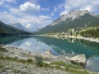 Mountains reflected in the lake near Sufers