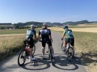 Oli, Urs, and Adi atop a hill in Aargau