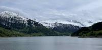 View of the snowy mountains above the ... the Wägitalersee in the foreground