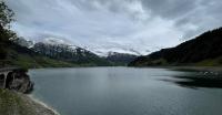 Wide-angle view of the snowy mountains... the Wägitalersee in the foreground